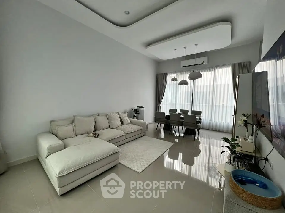 Spacious modern living room with elegant dining area and stylish decor