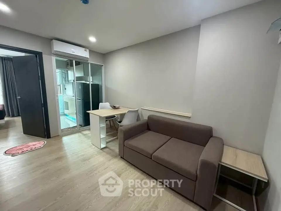 Modern living room with sleek design and cozy furniture in a stylish apartment.