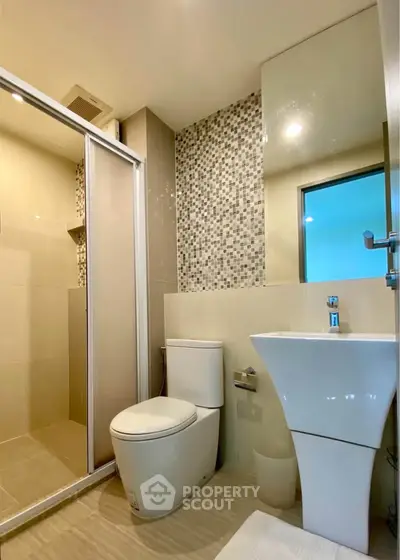 Modern bathroom with sleek fixtures and stylish tile design