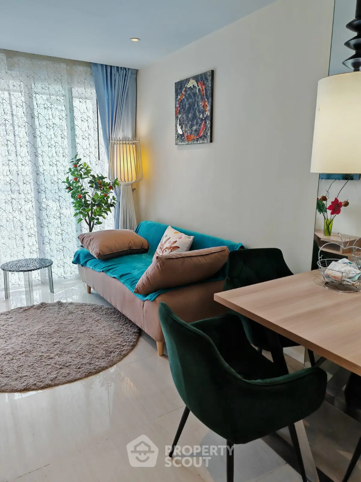 Stylish living room with modern decor, cozy sofa, and dining area, perfect for urban living.