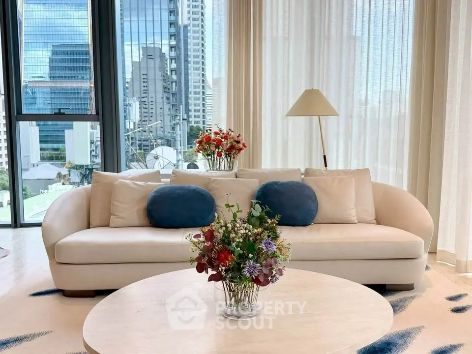 Luxurious living room with modern sofa and city view, perfect for urban living.
