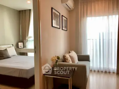 Modern apartment interior with cozy bedroom and stylish living area, featuring elegant decor and natural light.