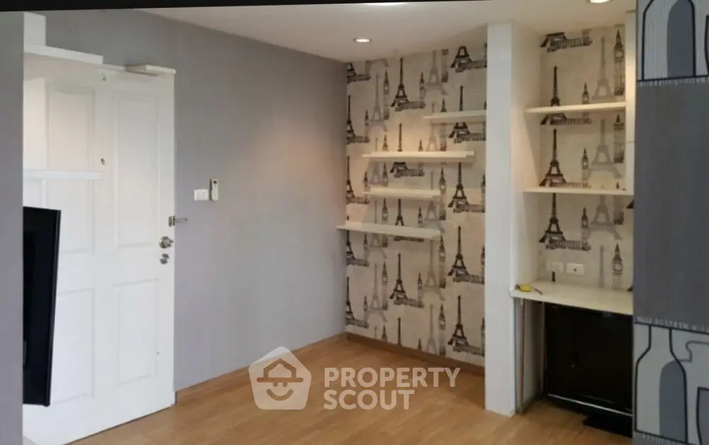 Chic modern living room with Eiffel Tower wallpaper and built-in shelves