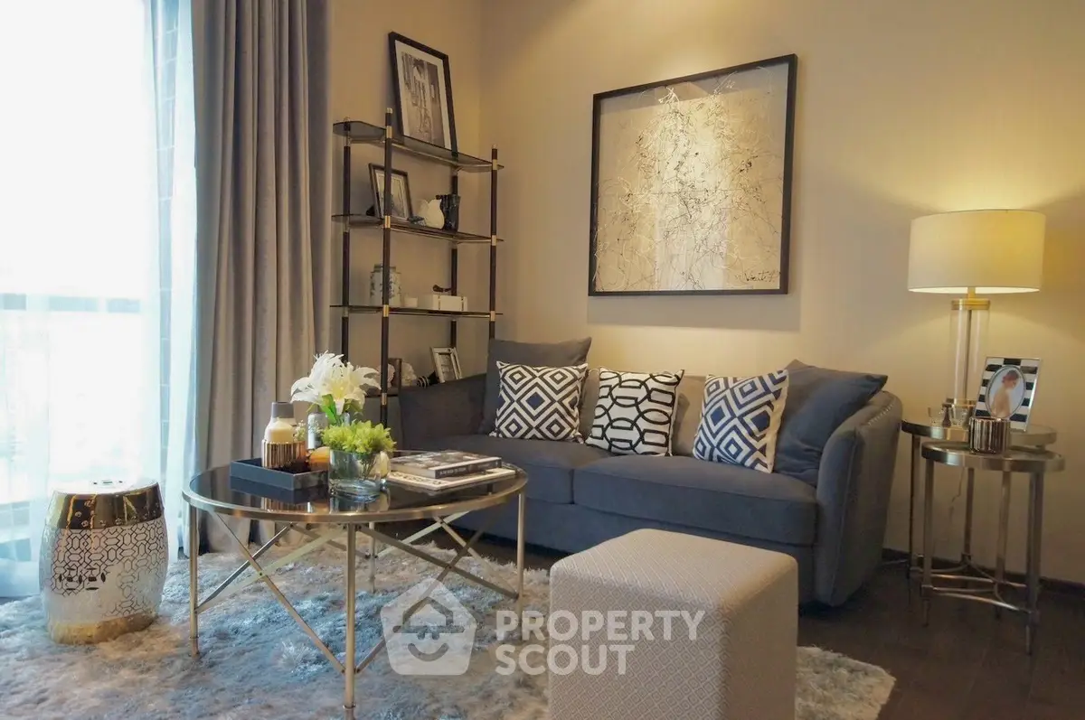 Stylish living room with modern decor, cozy sofa, and elegant lighting.
