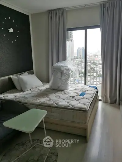 Cozy bedroom with city view and modern decor in urban apartment