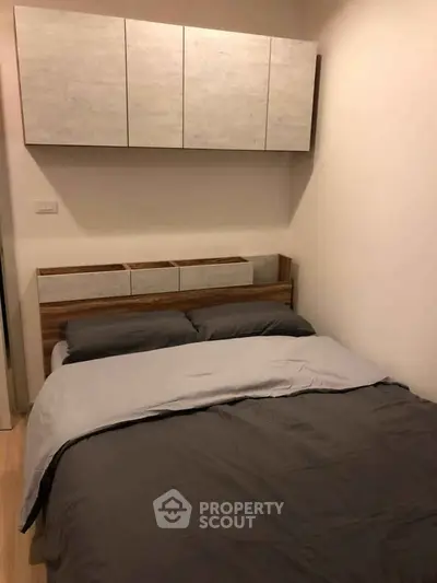 Cozy bedroom with modern storage cabinets and stylish bedding