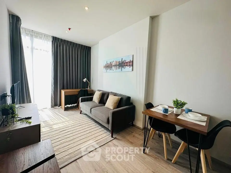 Modern living room with stylish decor and natural light in a contemporary apartment.