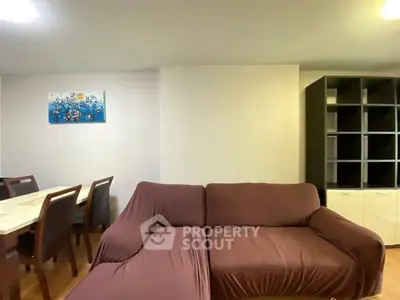 Spacious living room with modern furniture and dining area
