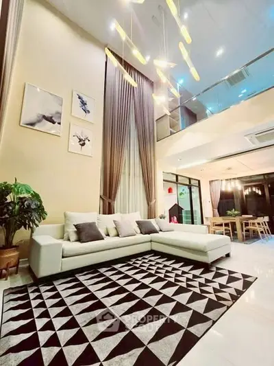 Luxurious modern living room with high ceilings and elegant decor