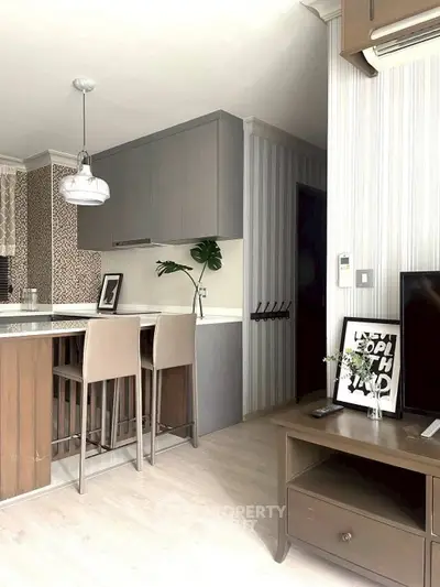 Modern kitchen with open layout and stylish decor in a contemporary apartment.
