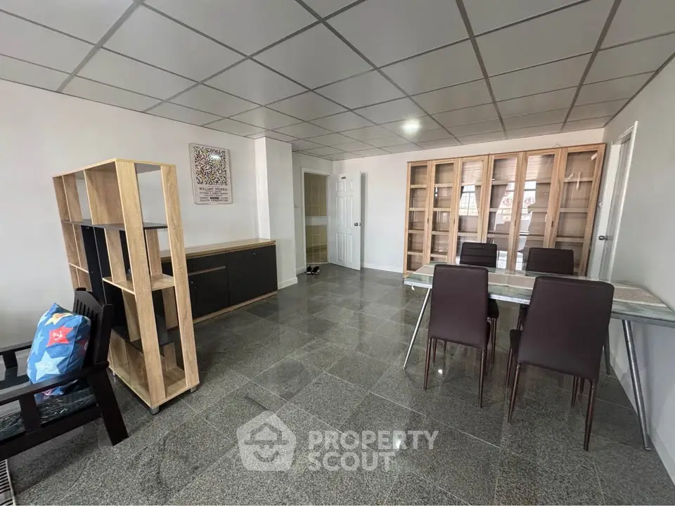 Spacious modern living room with sleek tile flooring and stylish furniture