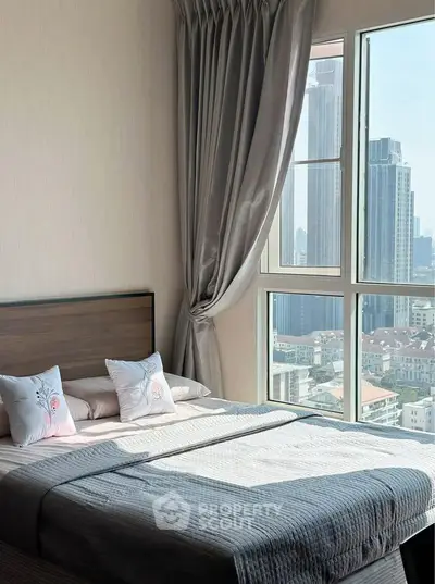 Luxurious bedroom with stunning city view and elegant decor
