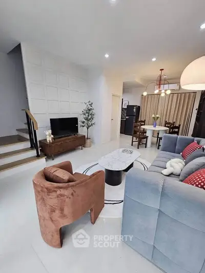 Stylish modern living room with cozy seating and elegant decor, perfect for relaxation and entertainment.