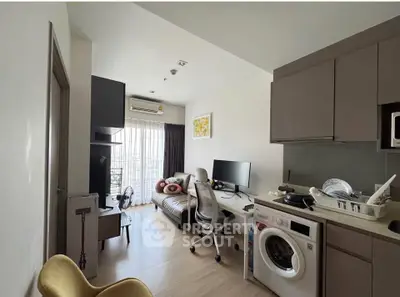 Modern apartment living room with washing machine and open kitchen layout