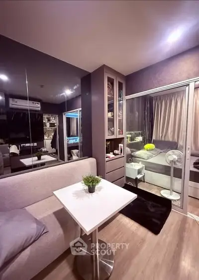 Modern living room with sleek design and cozy ambiance in urban apartment