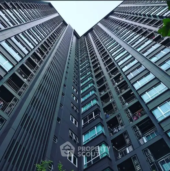 Stunning high-rise building exterior with modern architectural design and expansive windows.