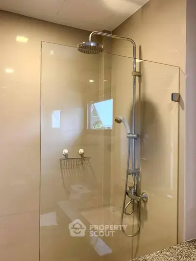 Modern bathroom with sleek glass shower and contemporary fixtures