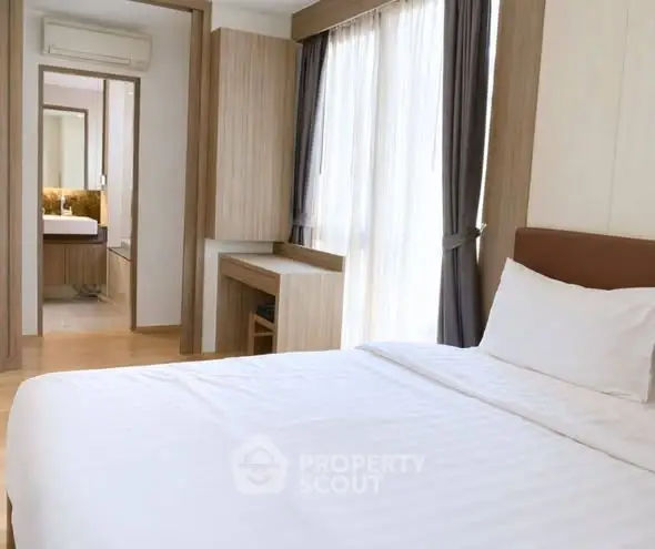 Modern bedroom with large windows and stylish decor