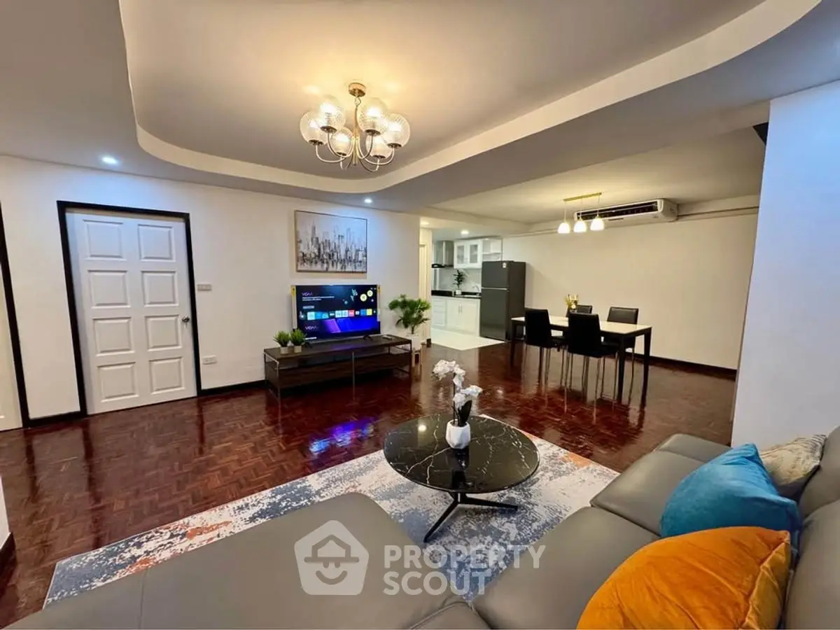 Spacious modern living room with open kitchen and elegant decor