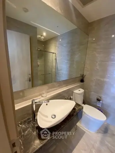 Modern bathroom with sleek fixtures and elegant marble countertop