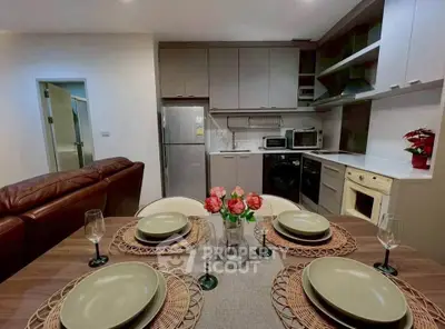 Modern kitchen and dining area with stylish decor and appliances