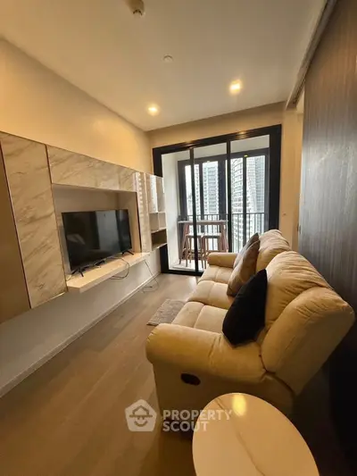 Modern living room with cozy sofa and balcony view in high-rise apartment