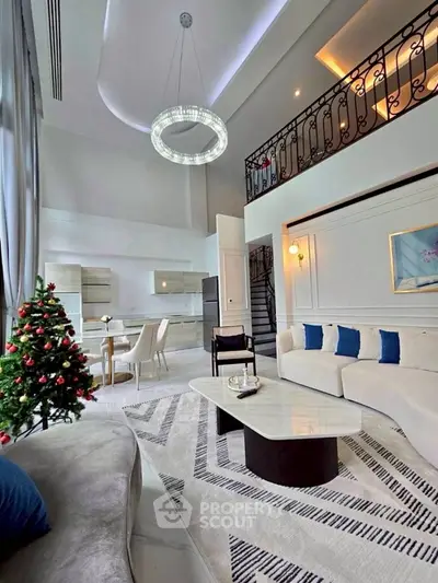 Luxurious living room with high ceilings, elegant decor, and a festive Christmas tree, perfect for holiday gatherings.