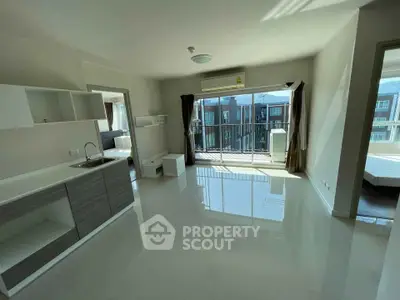 Spacious modern apartment with open layout and balcony view