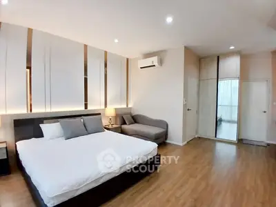 Spacious modern bedroom with elegant decor and cozy ambiance