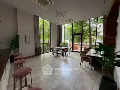 Spacious modern living room with large windows and stylish furniture
