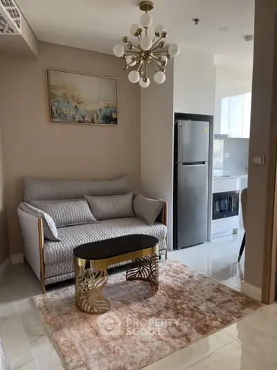 Modern living room with elegant decor and stylish kitchen area