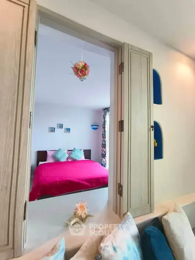 Charming bedroom view with vibrant decor and cozy ambiance, perfect for relaxation and comfort.