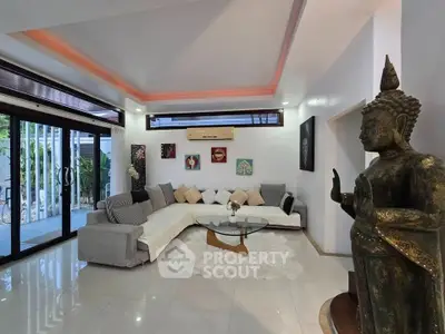 Luxurious living room with modern decor and large windows for natural light.
