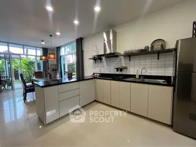 Modern open kitchen with sleek design and garden view