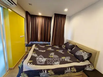 Cozy bedroom with modern decor and large window for natural light