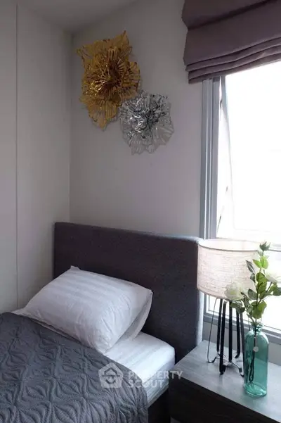 Cozy bedroom with modern decor and natural light