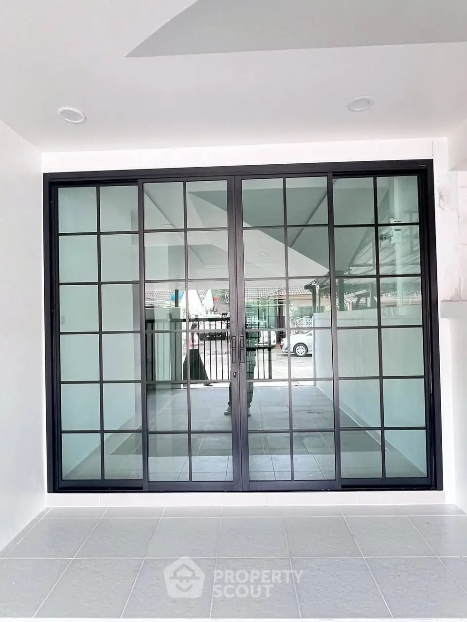 Modern sliding glass doors leading to a spacious patio area.