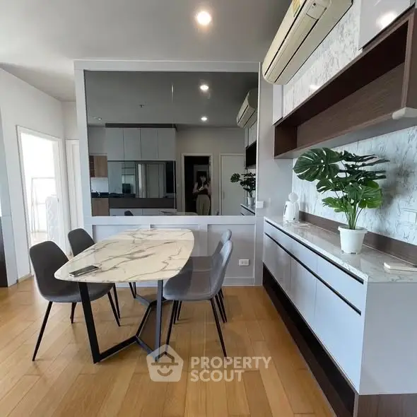Modern dining area with elegant marble table and stylish decor