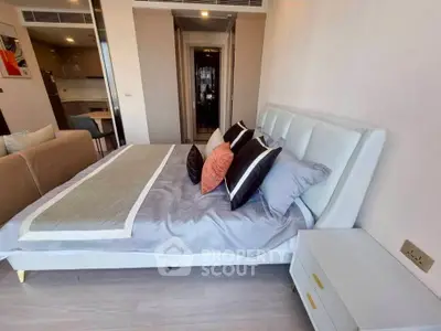 Modern bedroom with stylish decor and cozy ambiance in a contemporary apartment.
