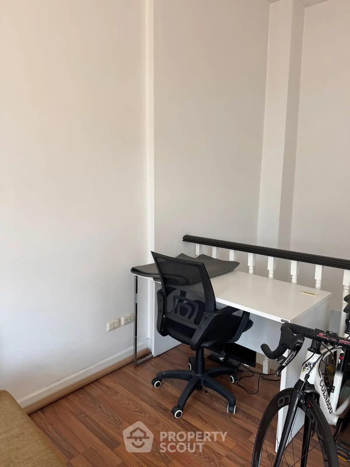 Modern study nook with sleek desk and ergonomic chair, perfect for productivity.