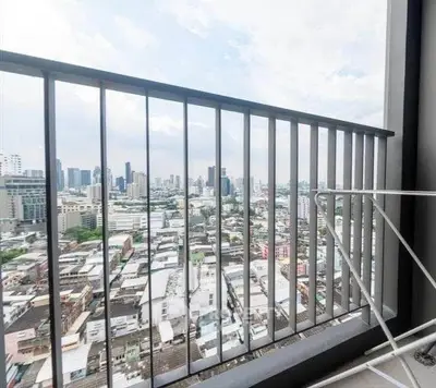 Stunning cityscape view from a high-rise balcony, perfect for urban living enthusiasts.