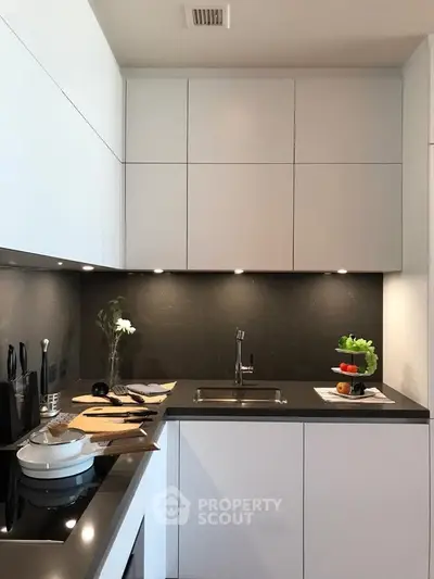 Modern kitchen with sleek cabinetry and integrated appliances, perfect for contemporary living.