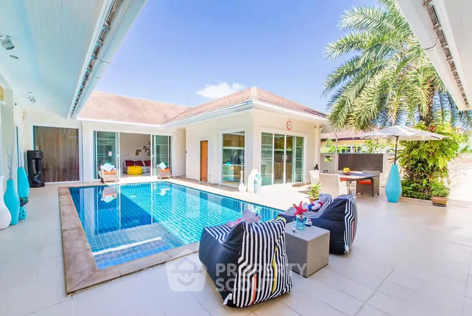 Luxurious villa with private pool and modern outdoor lounge area