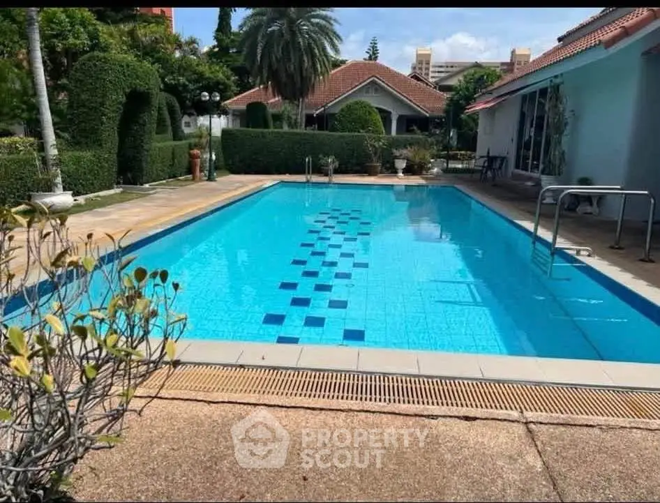 Luxurious villa with private pool and lush garden, perfect for relaxation and entertainment.
