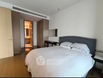 Spacious modern bedroom with ensuite bathroom in luxury apartment