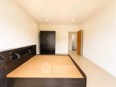 Spacious bedroom with modern design and ample natural light