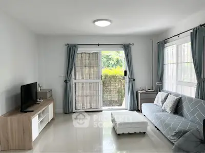 Bright and airy living room with modern decor and large windows for natural light.