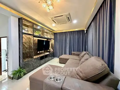 Luxurious living room with plush sectional sofa and elegant marble TV wall