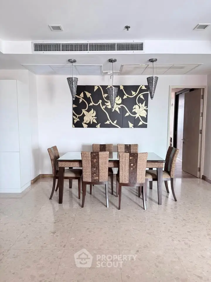 Elegant dining area with modern decor and stylish lighting
