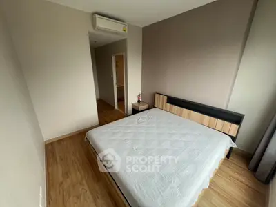 Modern bedroom with minimalist design and wooden flooring